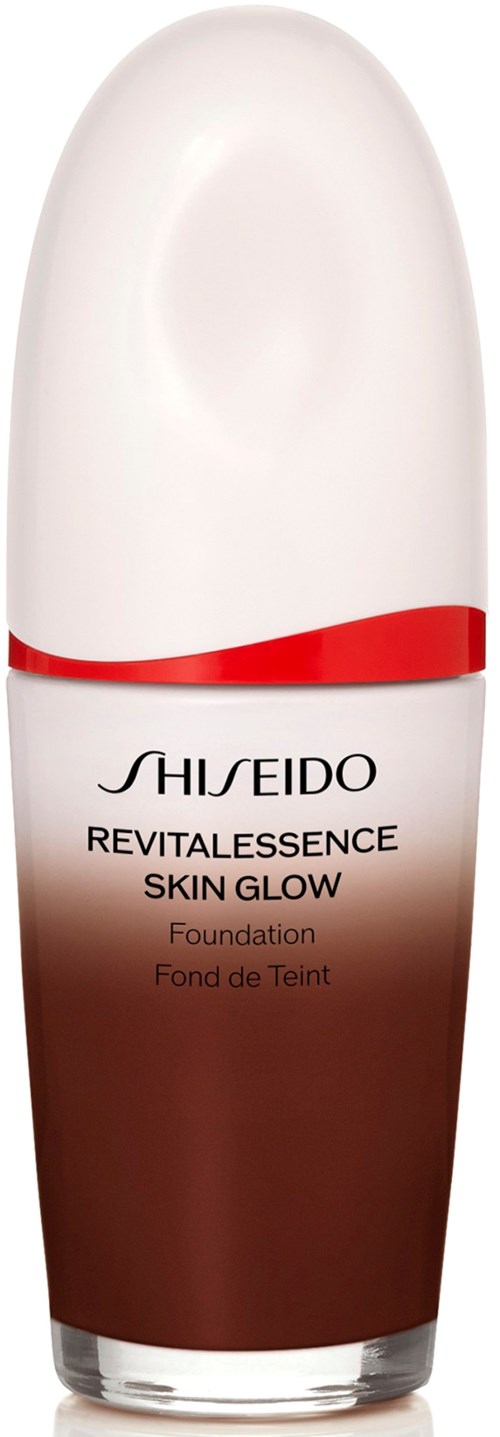 A bottle of Shiseido Revitalessence Skin Glow foundation with a white cap and red and brown label.