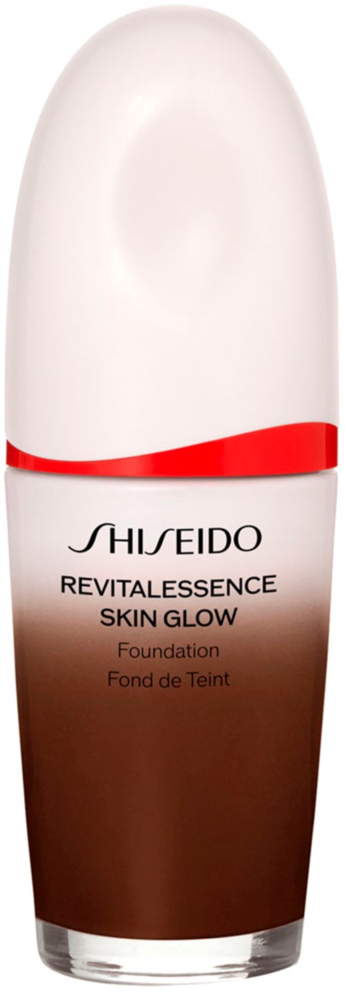 A bottle of foundation from Shiseido, called Revitalness Skin Glow, with a white and brown design and a red band.