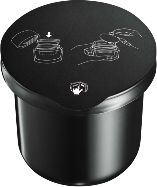 A black container with a lid. Instructions show opening the lid and removing tags or covers.