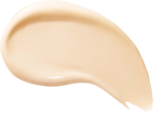 Beige-vaahto tai voide levitetty kaareva muotoon valkoiselle taustalle.