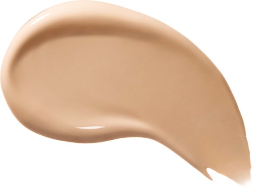 Beige nestemäinen meikkitahra, jossa sileä pinta ja pyöristetyt reunat.