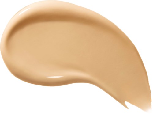Viskiläis beige neste, mahdollisesti meikkiä tai peiteainetta, valkoisella taustalla.