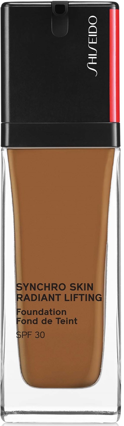 Meikkivoidepullo, jossa musta korkki, nimeltä 'Shiseido Synchro Skin Radiant Lifting,' SPF 30, läpinäkyvässä astiassa.