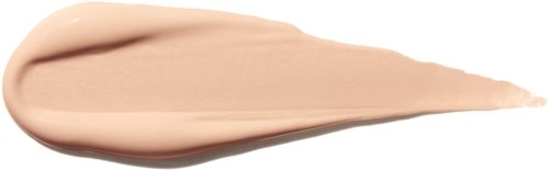 En beige kräm eller lotion med spetsig ände, spridd på en vit bakgrund.