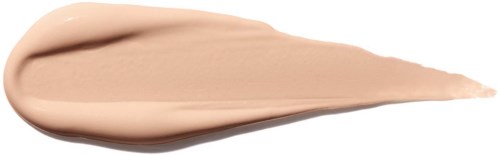 En beige foundation eller kräm med en spetsig ände och en slät yta.