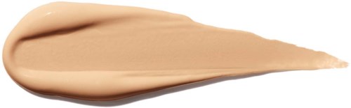 En beige krämig substans spridd i en tårform, med en tjockare rund end och en spetsig spets.