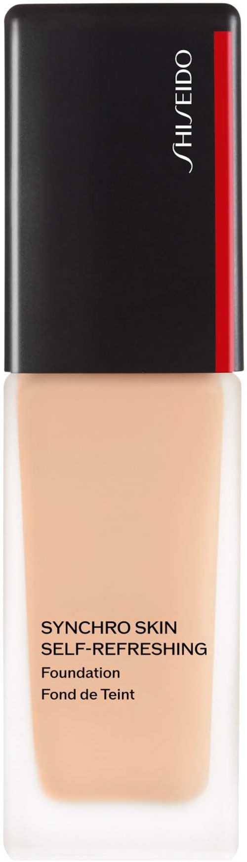 En flaska av foundation med svart lock, beige flytande, och röda detaljer på locket.