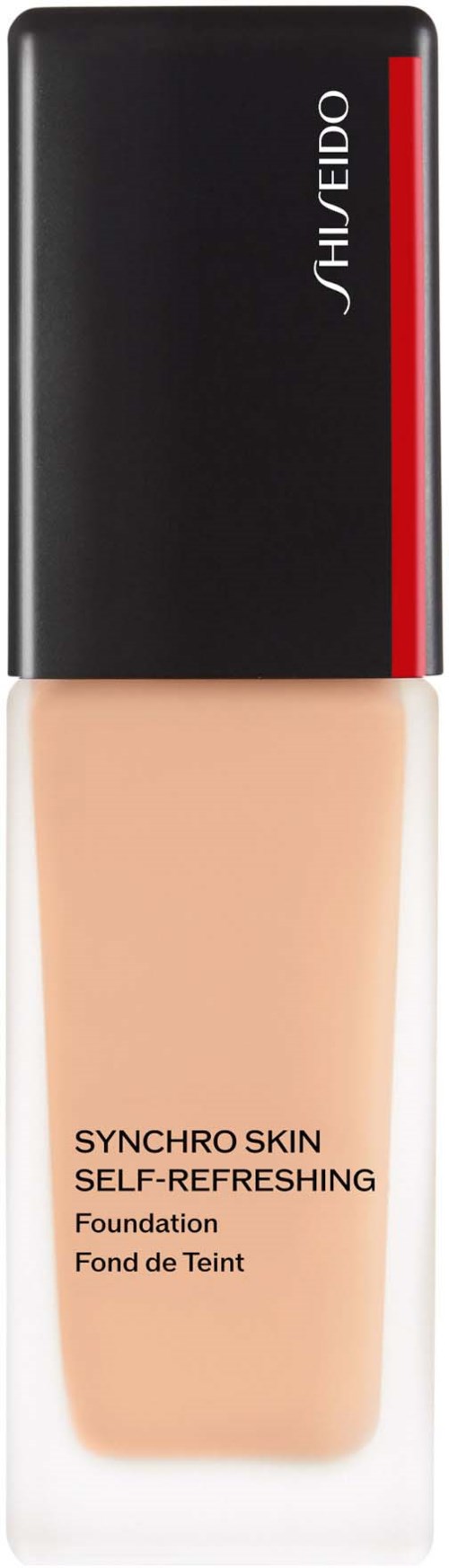 En foundationflaska med svart och röd lock, beige vätska inuti, märkt "Synchro Skin Self-Refreshing."