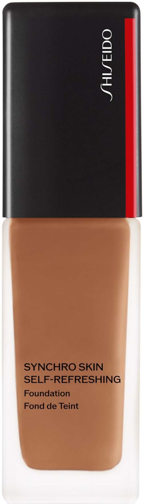 En flaska av sminkfoundation från Shiseido, märkt Synchro Skin, med svart, röd och klar förpackning.