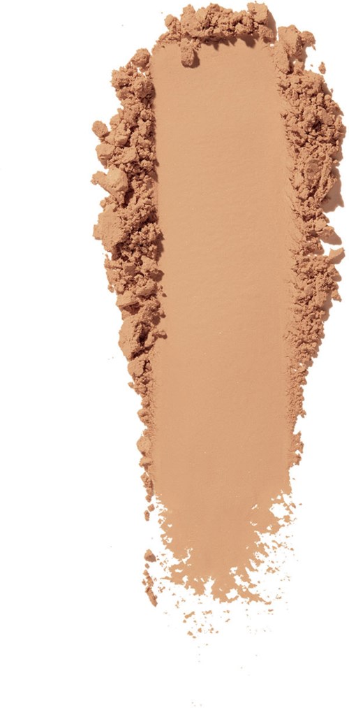 Ett beige pulver spridd i en långsträckt form, med löst pulver runt kanterna.