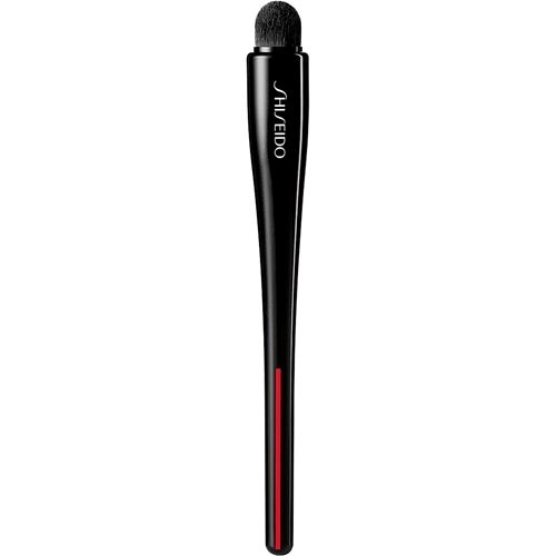 A black makeup brush with a rounded top and a red line near the bristles. The brand name 'Shiseido' is printed on it.