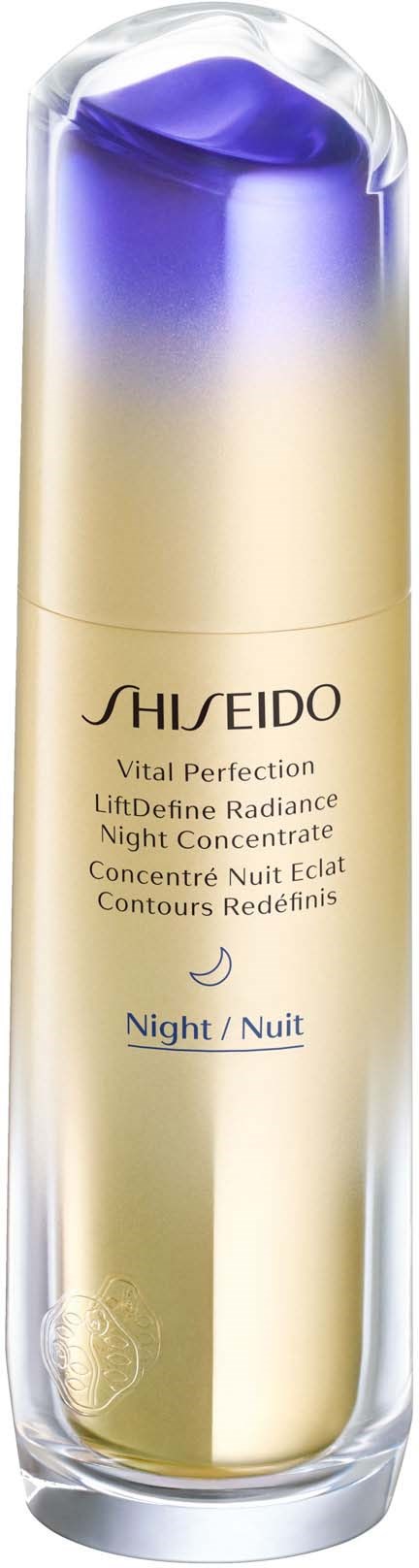 A tall bottle with a purple gradient cap, labeled Shiseido Vital Perfection Night Concentrate, in a clear container.