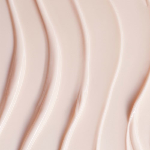 En närbild av en rosa, texturerad yta med böjda linjer som bildar ett vågmönster.