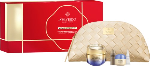 Shiseido Vital Perfection hudvårdsset med kräm, serum, ögonkräm och en beige vävd reseväska.