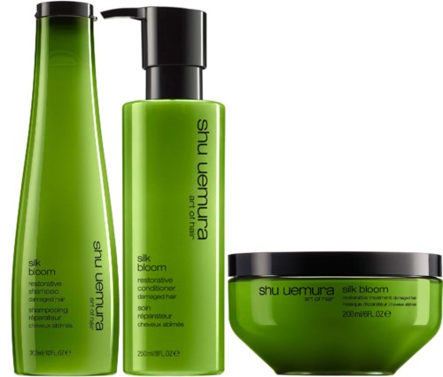 Drei grüne Haarpflegeprodukte: Shampoo, Conditioner und Haarkur, alle aus Shu Uemuras Silk Bloom-Serie.
