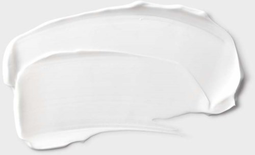 Weiße Creme auf einer Oberfläche, wahrscheinlich ein Hautpflege- oder Kosmetikprodukt.