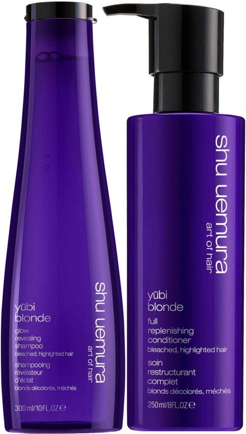 Twee paarse haarproducten, shampoo en conditioner, met zwarte doppen en witte tekst op de flessen.