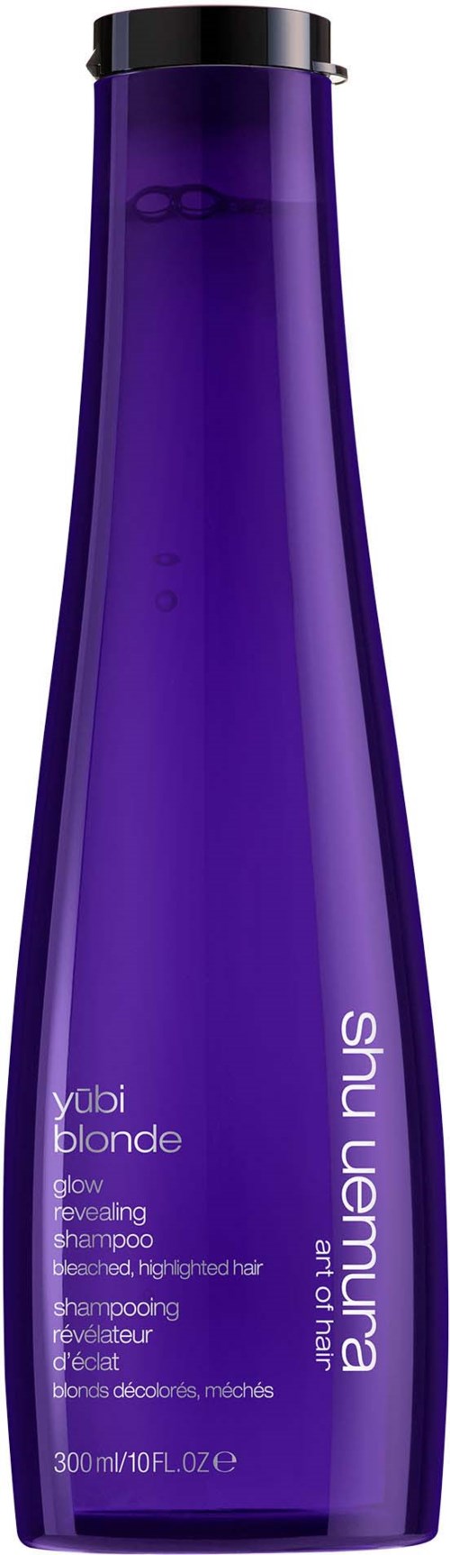 Eine lange, lila Shampoo-Flasche mit schwarzen Deckel, beschriftet mit 'shu uemura' und 'yubi blonde' in Weißtext.
