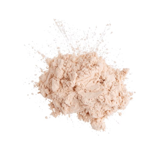 A light pink powder with some splashes, appearing soft and crumbly, set against a white background.