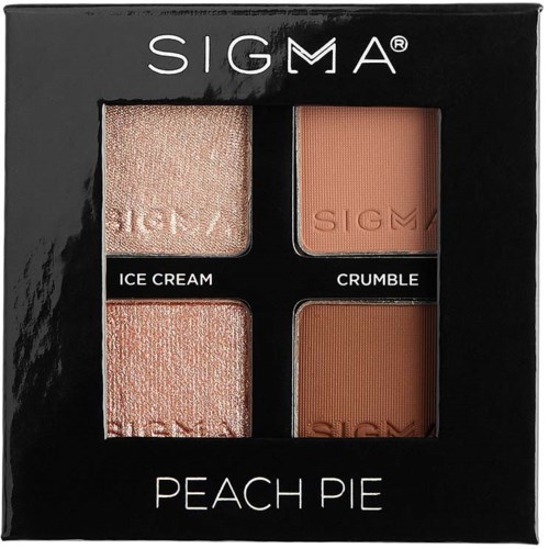A makeup set with four peach-colored shades, labeled Ice Cream, Crumble, and two other shades, in a black box.