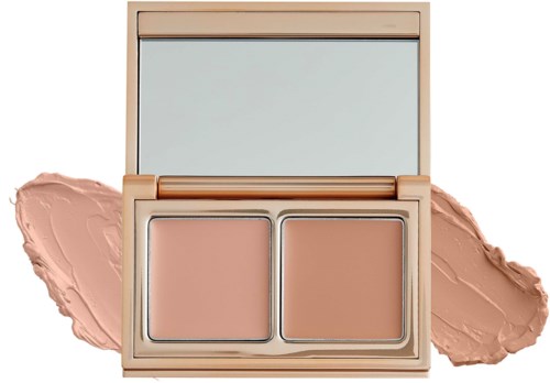 A beige makeup compact with two powder sections and a mirror on top, with cream swatches on each side.