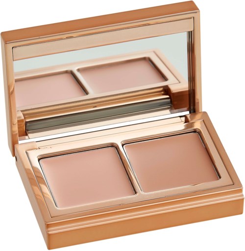 A compact makeup case with two foundation pans and a mirror inside the lid.