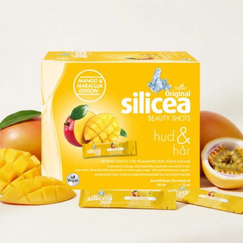 Bright yellow box of Slicesa beauty shots with mango and passion fruit illustrations, beside sliced mango and passion fruit.