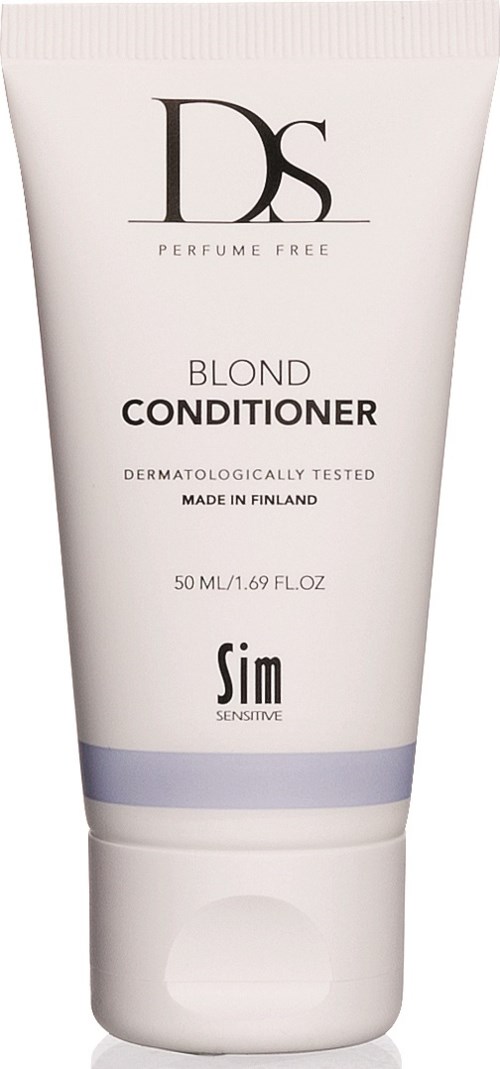 En vit tub med svart och lila text. Den är märkt som ett blont balsam för känslig hud, tillverkat i Finland.