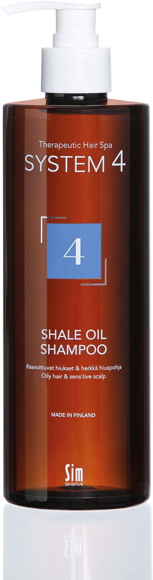 Eine braune Flasche mit weißem Pumpkopf, beschriftet 'System 4 Shale Oil Shampoo' für Haare und Kopfhaut