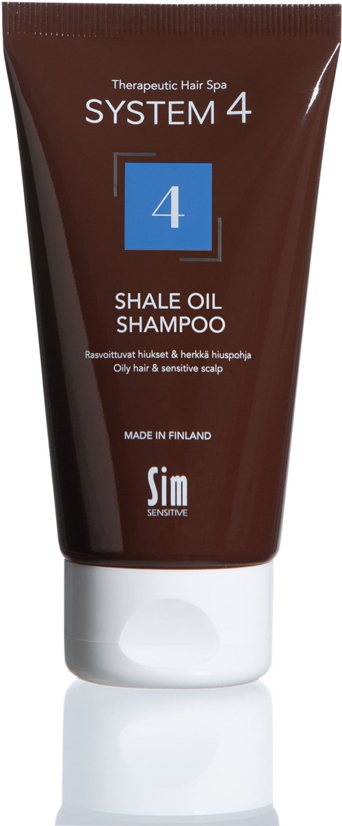 A brown tube of shampoo with white cap, labeled 'SYSTEM 4 Shale Oil Shampoo' for oily and sensitive scalp.