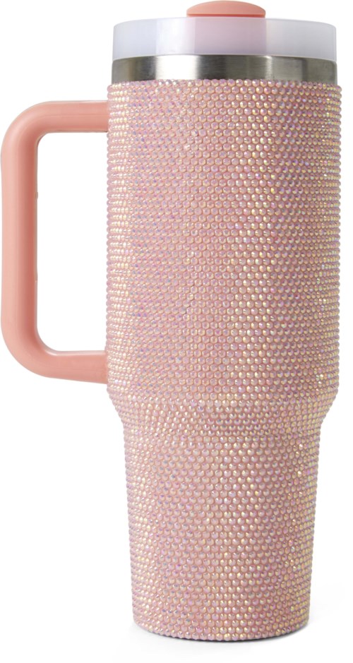 A tall travel mug with a pink handle and covered in pink sparkles. It has a beige and light pink lid.