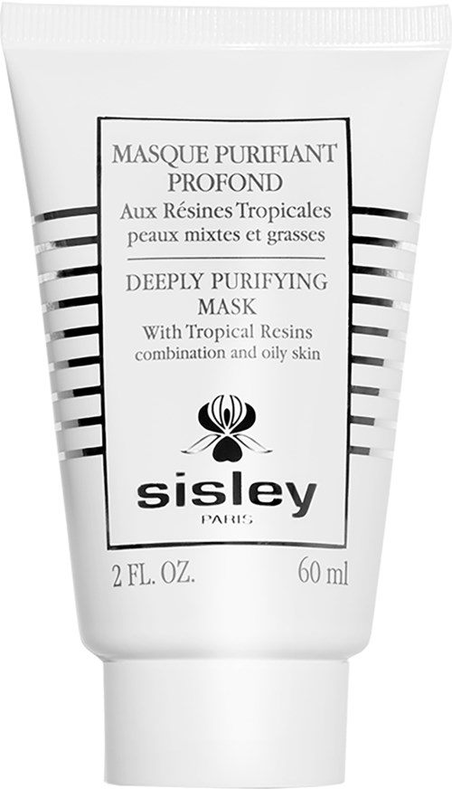 En hvit tube med ansiktsmaske med svart/hvit tekst og et bladlogo. Den nevner rensende og tropiske ingredienser.