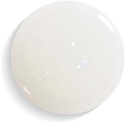 Een wit, rond object met een paar kleine bubbel op het oppervlak, lijkt op een druppel of kleine bal.