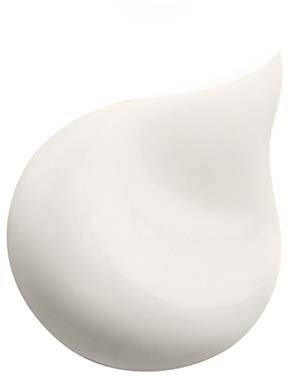 A white, curved, bowl-shaped object with a smooth surface. It has a pointed end and a rounded opening.
