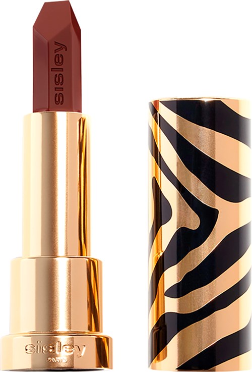 A lipstick with a leopard print black and beige cap, showing the red lipstick inside.