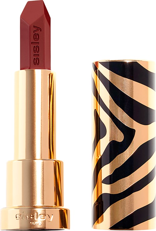 Bildet visar ett läppstift med röd färg, gulddräkt och svart och beige zebra-mönster på locket.