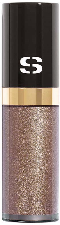 A beauty product with a black and gold top, containing shiny, glittery makeup or lip gloss.