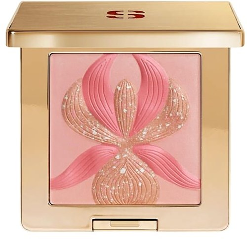 A compact with a pink and gold swan design on the lid, featuring a pink background and elegant details.