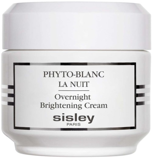 A white jar labeled 'Phyto-Blanc La Nuit Overnight Brightening Cream' by Sisley Paris.