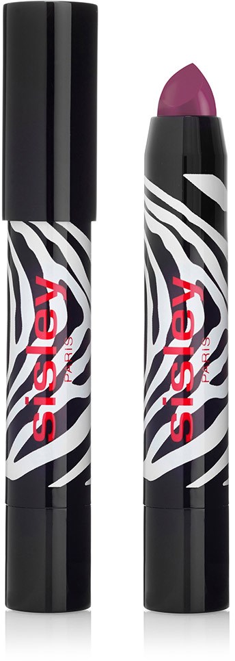 En svart och vit zebra-randig rör med röd text som innehåller rosa läppstift.