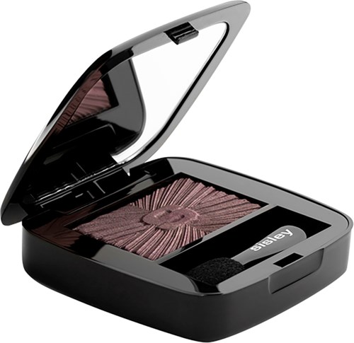 A black makeup compact with brownish blush and a small mirror inside, open showing the powder.