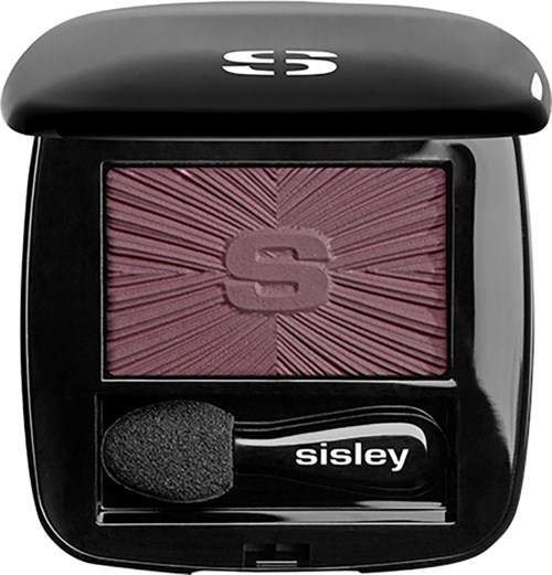 En svart blush med rosa rouge och en svamp applikator inuti.