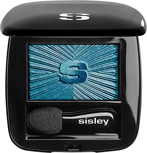 A black compact case with a mirror and a small brush, marked with the word 'Sisley' and a blue 'S' on the screen.