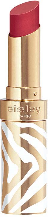 A gold lipstick tube with a pink lipstick and a white zebra pattern on the lower part.