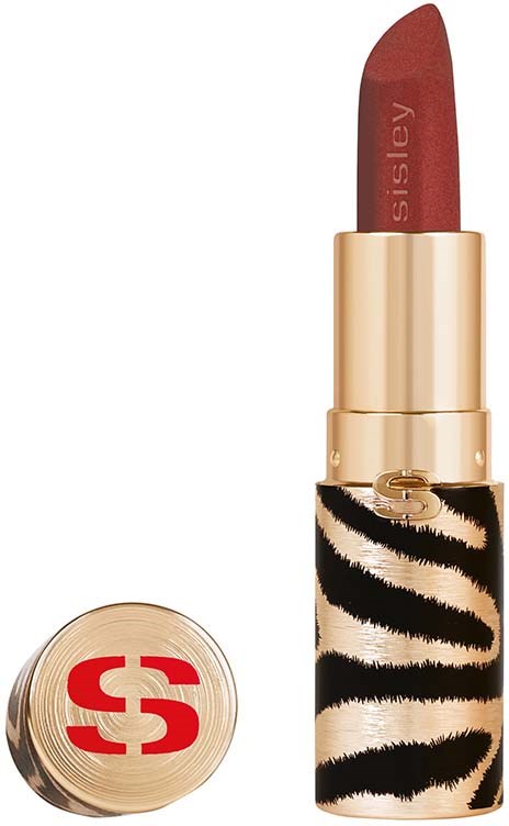 A lipstick with a red color, gold and tigerskin-style case, and a cap with a red logo.