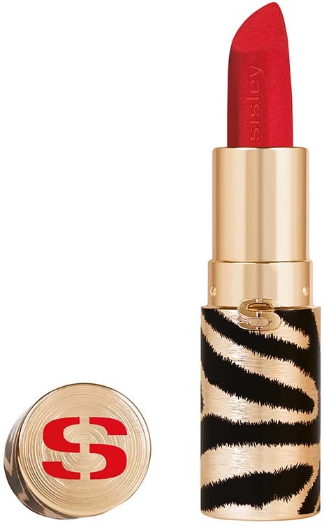 A red lipstick in a gold tube with black zebra strap design. The lipstick is slightly open and angled upward.