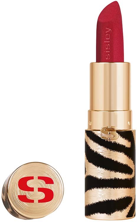 A red lipstick with a gold and zebra print case stands upright against a white background.