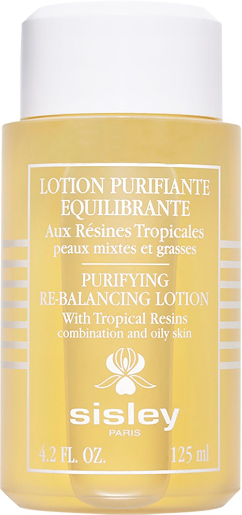 Geel flesje met witte dop, label zegt reinigende en balancerende lotion met tropische harsen voor vettige huid.