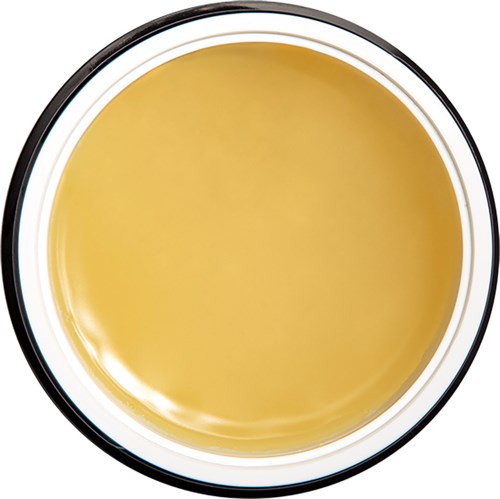 Eine Schüssel mit gelber Flüssigkeit, möglicherweise Suppe oder Sauce, umgeben von einem schwarzen und weißen Rand.