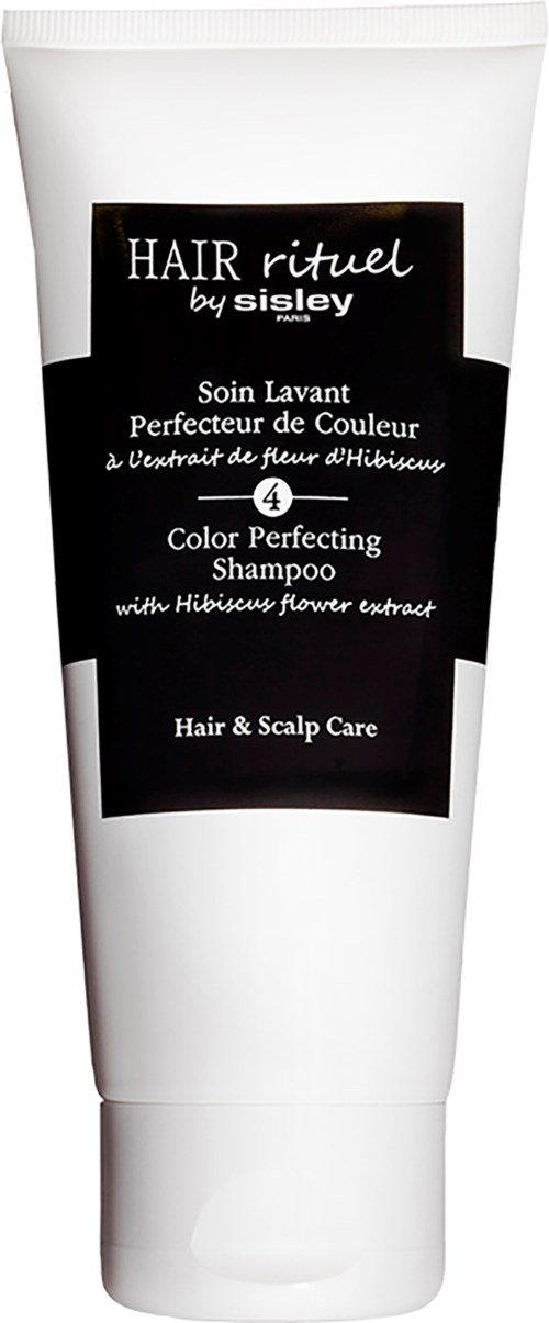 Witte shampoefles met zwart label, grijze dop, tekst over haar- en hoofdhuidverzorging, geur van hibiscus bloem.